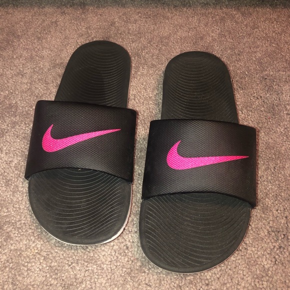 pink and black nike slides
